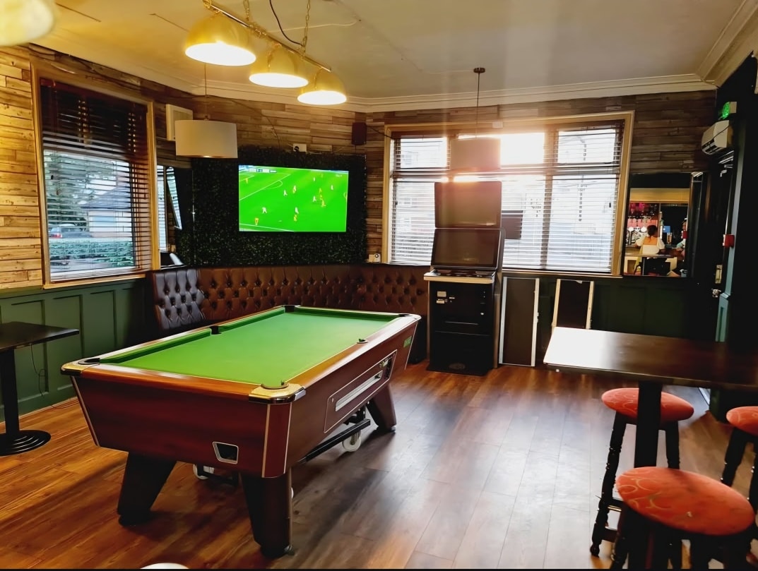 Griffin Bar interior with pool table and sports screens